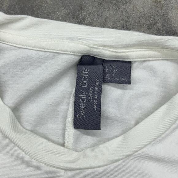 Sweaty Betty London Size Medium Wrap Front Long Sleeve Off White Tee Shirt Crop - Picture 7 of 10